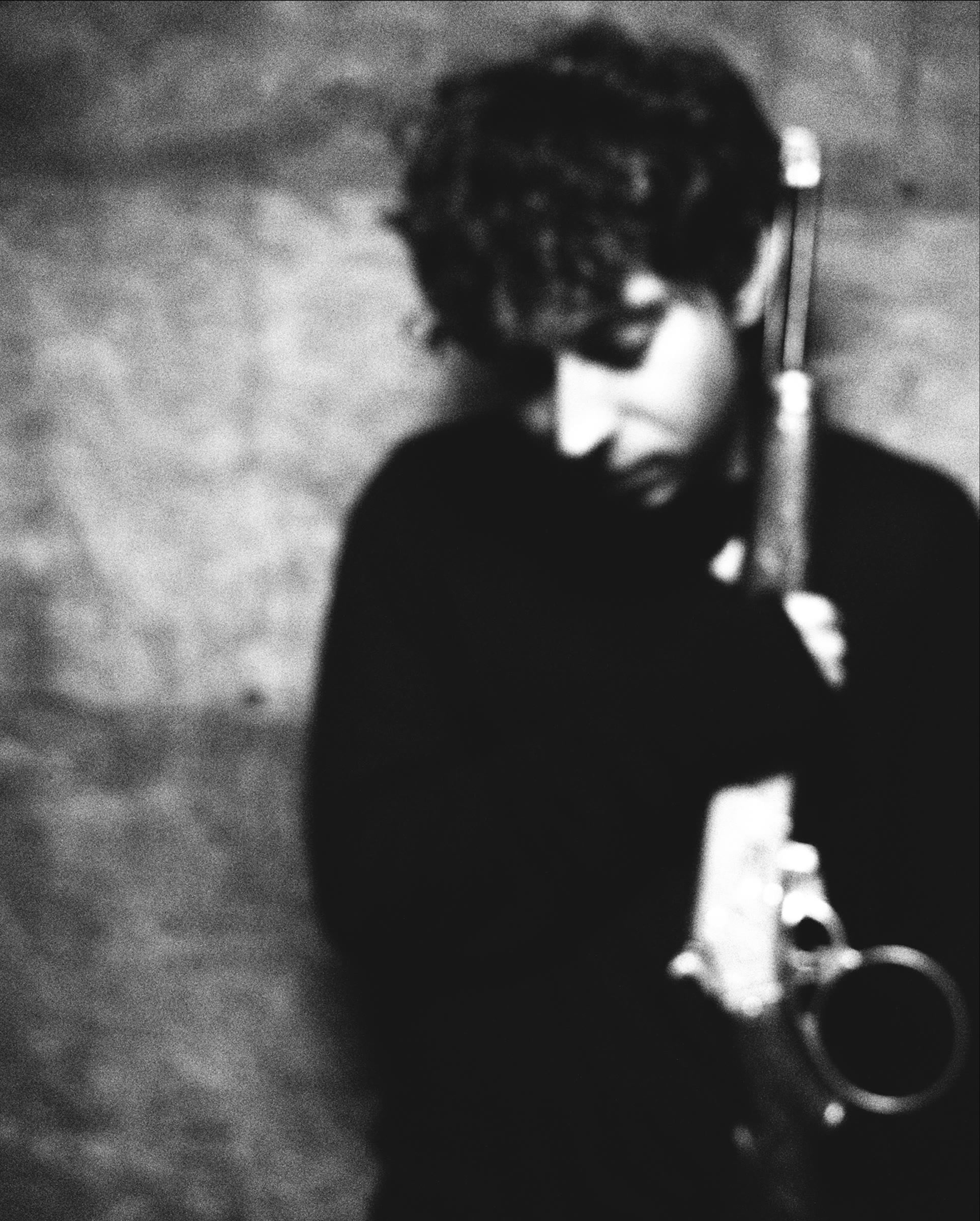 Rainfield in a grainy black-and-white portrait